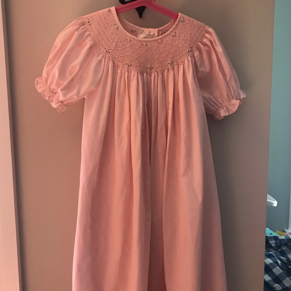 Soft pink Bishop-style smocked dress